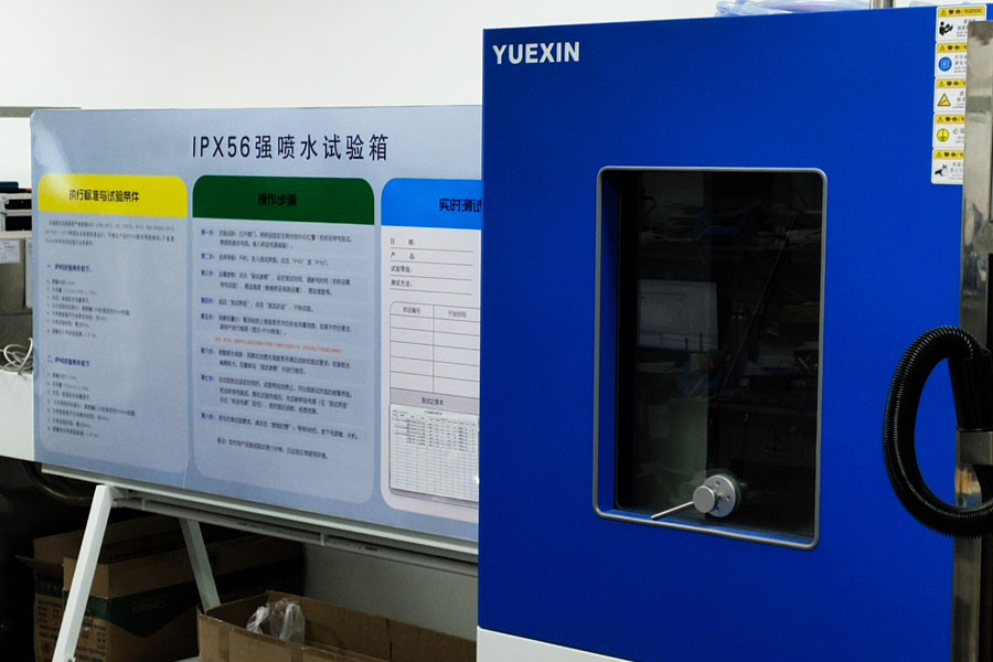 Rigorous IP65 waterproof testing chamber inspecting outdoor solar street lights at Lumin Solar Solutions.