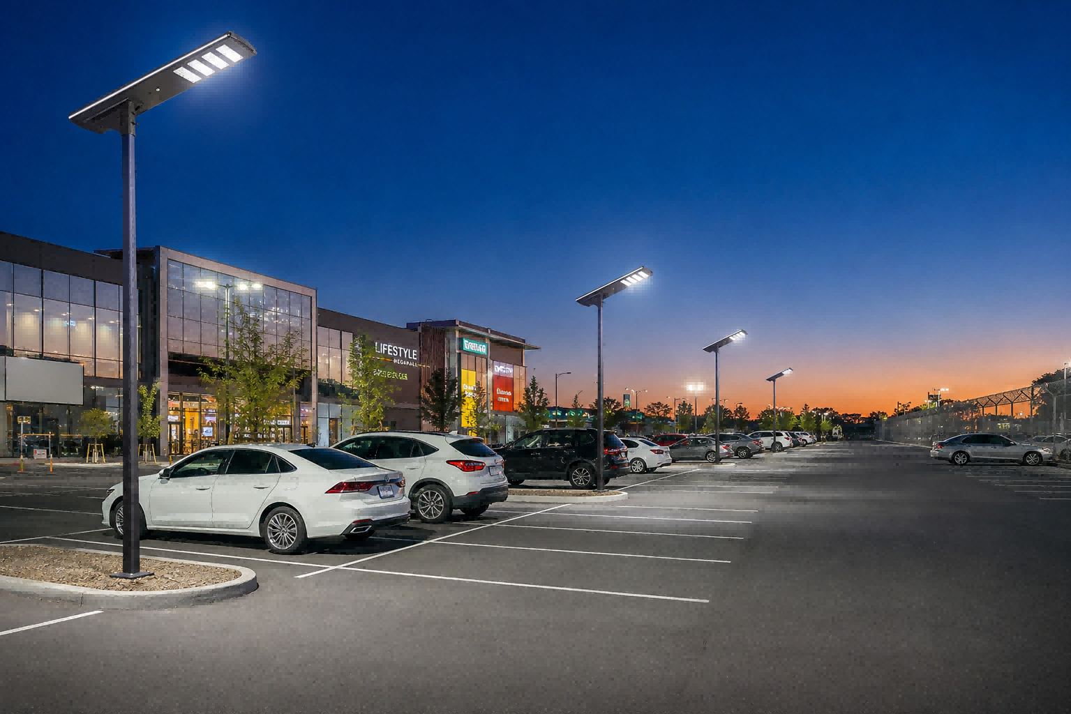 Commercial parking lot illuminated by high-lumen NVKZ-AL-MM-AI-3030 solar street lights near a retail plaza building.